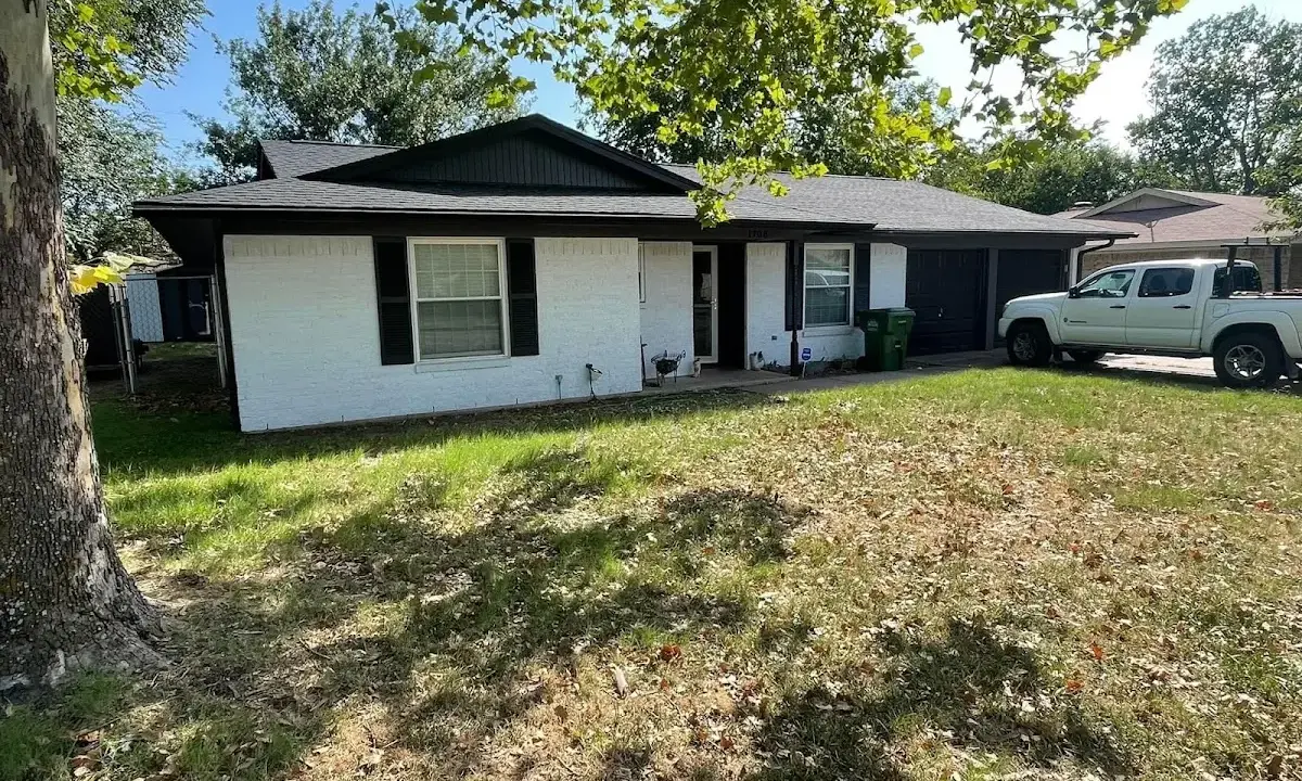 Professional roofing crew working on a residential roof in Loudon